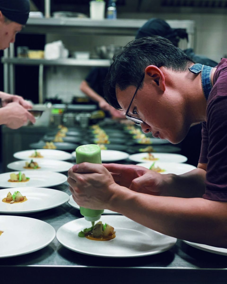 Basilico's chefs plating dishes in the kitchen